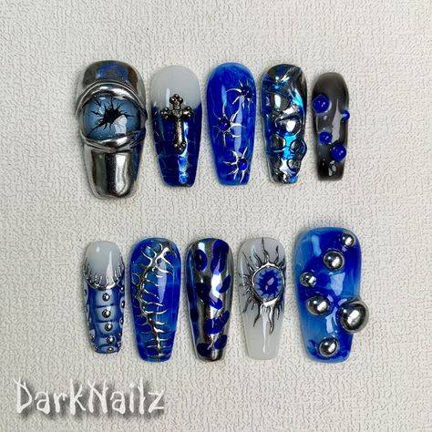 Custom Blue Press On Nails, Y2K Silver Sun Press On Nailsbring a touch of nostalgia and futuristic style to your fingertips. With a wide range of colors, designs, and finishes, these press on nails allow you to express your individuality and stay on top of the latest trends. Whether you prefer bold and vibrant shades or subtle and sophisticated designs, DarkNailz press on nails offer endless possibilities for creating your desired look. [PLEASE READ BEFORE PURCHASING] All sets are made with GEL Edgy Blue Nails, Cybersigil Nails, Blue Press On Nails, Nails Design Blue, Dark Blue Nails Ideas, Blue And Silver Nails, Edgy Nails, Y2k Nails, Futuristic Style