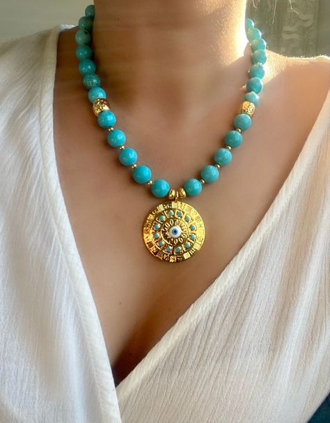 #etsy: Genuine Turquoise Necklace,Beaded Turquoise and Evil Eye Gold Medallion Necklace,Eyecatching Gemstone Summer Jewelry,https://etsy.me/46LlZ4z #genuineturquoisenecklace #goldbluemedallion #bigboldbeadednecklace #gemstonejewelry #bluenecklace #statementnecklace Turquoise Jewelry Necklace Gold, Big Pendant Necklace, Chunky Turquoise Necklace, Pearl Neck, Gold Medallion Necklace, Necklace Evil Eye, Jewerly Beads, Unique Birthday Gift, Gold Medallion