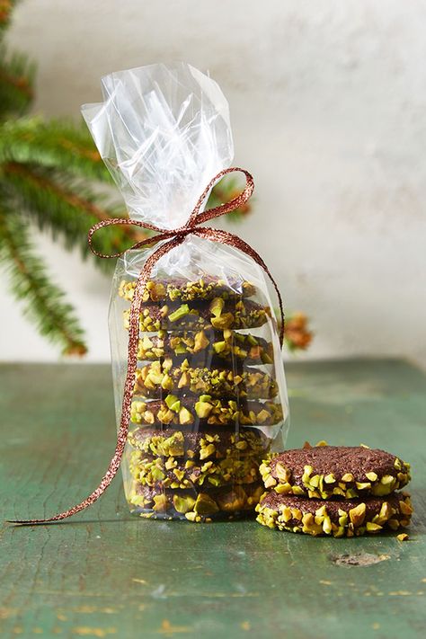 Skip the bag of pistachios this year — try these nutty, chocolate cookies instead. Click through to get the recipe and see more of the best Christmas cookies! #christmascookiesrecipes #christmasrecipes #christmasideas #christmascookieideas #christmascookieseasy بيتي فور, Slice And Bake Cookies, Edible Holiday Gifts, Italian Christmas Cookies, Chocolate Slice, Best Christmas Cookie Recipe, Pistachio Cookies, Delicious Christmas Cookies, Cookie Recipes Unique