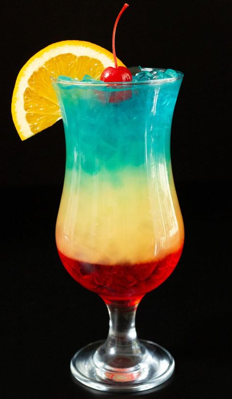 This beautiful, rainbow layered cocktail tastes like a tropical paradise in a glass! It's the perfect drink for summer or hot weather. One sip and you'll feel like your on an island vacation. Rainbow Paradise Cocktail, Tropical Drinks Aesthetic, Rum Sunset Cocktail, Umbrella Drinks Tropical, Tropical Cocktails Aesthetic, Paradise Cocktail, Layered Cocktails, Tropical Drink, Flavored Water