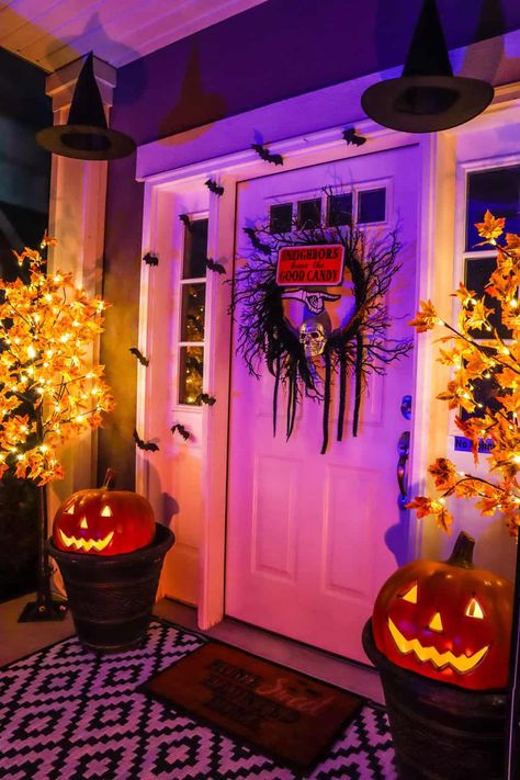 How to Decorate Your Front Porch for Halloween on a Budget: 21 Easy and Inexpensive Ideas - Practical Perfection Halloween Outside House Decorations, Fall Front Porch Ideas On A Budget, Front Porch Witch Decorations, Halloween Lights Outdoor Porch, Halloween Apartment Decor Front Doors, Halloween House Decorations Outdoor, Maxamilist House, Halloween Decorations Front Porch, Gothic Patio