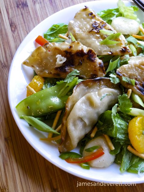 Pot Sticker Salad | James & Everett Pot Sticker Salad, Sesame Dressing Recipe, Asian Sesame Dressing, Pot Sticker, Sesame Dressing, Mandarin Oranges, Pot Stickers, Garden Vegetables, Tossed Salad