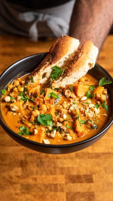 Andrew Bernard on Instagram: "Click here!! This recipe is in my IG profile bio!   This West African Peanut Stew has so much flavor people will think you got it from a restaurant!  Easy to make, loaded with veggies, perfect for cold days and meal prep!  Ingredients:  -onion -bell pepper -garlic -ginger -sweet potatoes -peanuts -chickpeas -fire roasted tomatoes -stock -peanut butter -serrano pepper -leafy greens -tomato paste -spices  Full recipe in the bio links or get the recipe by searching “peanut stew” at makeitdairyfree.com https://makeitdairyfree.com/one-pot-west-african-peanut-stew-vegan/   #mealprep #soup #souplover #vegansoup #soupseason #stew #wfpb #eatyourveggies  #musttryfood #meatlessmondays #vegan  #veganrecipes #plantbasedrecipe #easymeal #easyrecipe #recipevideo #blackmencoo African Sweet Potato Peanut Stew, Andrew Bernard, West African Peanut Stew, Peanut Stew Vegan, Meal Prep Ingredients, Chilli Soup, Stew Vegan, African Peanut Stew, Vegan Chilli