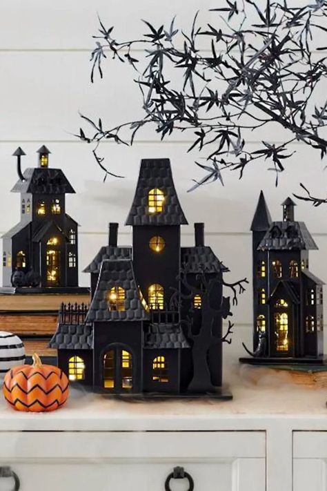 If you're someone who loves to decorate your mantel with Christmas homes during the holidays, then these haunted houses are the perfect Halloween decor. The battery-operated timer (which can last six hours) means you'll have a glow throughout your whole evening. Christmas Homes, Autumn Diy, Haunted House Decorations, Halloween Mantel, Diy Halloween Decor, Lantern Post, Halloween Village, Scary Halloween Decorations, Grandin Road