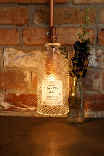 Light at the end of the Gin | gooey_lewy | Flickr Recycled Lamp, Pallet Bar Diy, Industrial Diy, Gin Bottle, Game Room Bar, Pallet Bar, Gin Bottles, Alcohol Bottles, Diy Bar