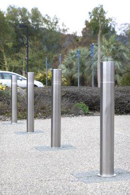 Stainless steel operable bollards provide a modern aesthetic Portable Fence, Stainless Steel Bolts, Light Pole, Stainless Steel Pipe, Iron Fence, Fence Panels, Modern Buildings, Home Decorators Collection, Decor Project