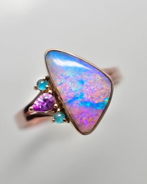 I’m so excited about how this collection is coming along so far! I have two new talismans to sow you today, followed but the other pieces that have come together so far! What’s your favorite of the two newbies? 1) This beauty is made with a vibrant purple and aqua opal! The strong duality between the colors is striking, and the piece is accented with Paraiba tourmalines and a fuchsia sapphire to accent the opals gorgeous colors. Set in rose gold! 2) this soft dusty rose opal has an ombre ... Opal Rose Gold Ring, Australian Opal Ring, Split Shank Ring, Heirlooms Jewelry, Paraiba Tourmaline, Vibrant Purple, Opal Ring, Australian Opal, Gemstone Healing