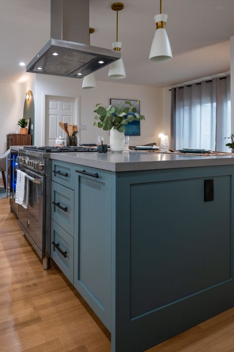 It's no secret that Drew & Jonathan love using color in their renovations! In this Property Brothers: Forever Home kitchen, they anchored a neutral kitchen with a dark teal kitchen island and added a pop of color with an abstract art print on the opposite wall. Check out a full design recap on drewandjonathan.com! Dark Teal Kitchen, Property Brothers Kitchen, Property Brothers Forever Home, 60" Bathroom Vanity, Stucco Finishes, Teal Kitchen, Opposite Colors, Neutral Kitchen, Property Brothers