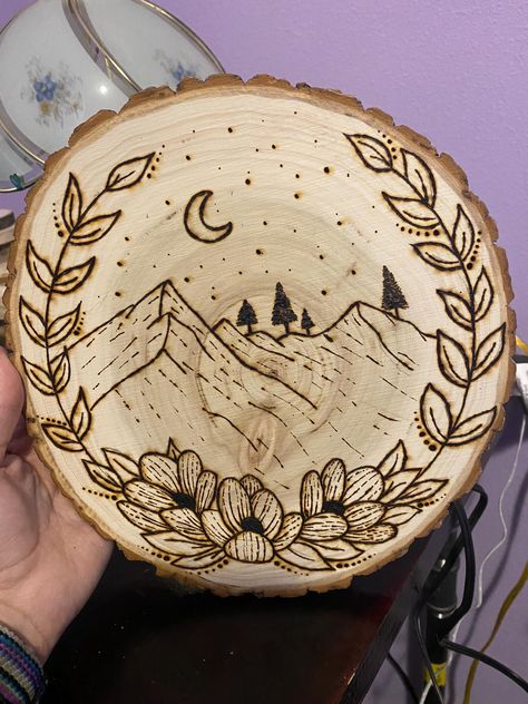 This is a pretty picture of some mountains with a flower border. It's a simple picture, but will be a great addition to any room. Completely hand burned! Things To Wood Burn Ideas, Woodburning Ideas Design, Western Wood Burning Ideas, Pirogravura Ideas, Simple Wood Burning Patterns, Easy Wood Burning Ideas, Cabin Projects, Wood Burning Ideas, Burning Mountain