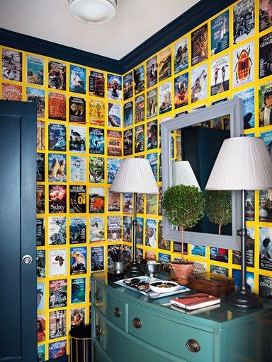 Room covered in National Geographic covers in Manhattan. Nyc Studio Apartment, National Geographic Cover, Flocked Wallpaper, Nyc Studio Apartments, Manhattan Loft, Manhattan Apartment, Wall Mounted Sink, New York City Apartment, Nyc Studio