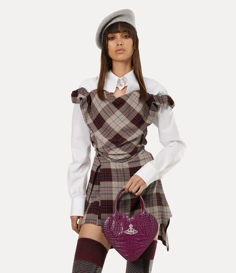 The heart-shaped Josephine Heart Crossbody bag returns in croc-embossed leather and showcases a single-compartment design. This classic style features a zip-around closure and our house's orb emblem on the front, a symbol created by Vivienne Westwood to reflect her idea of bringing tradition into the future. Heart Bag Outfit, Purple Vivienne Westwood, Vivienne Westwood Outfit, Vivienne Westwood Collection, Vivienne Westwood Style, Vivienne Westwood Bag, Vivienne Westwood Shop, Vivienne Westwood Fashion, Heart Crossbody Bag