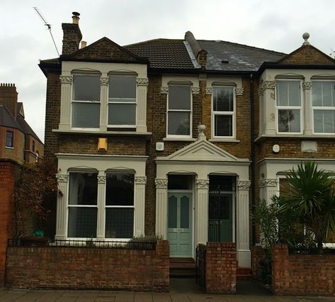 Semi-detached Victorian house in East End of London, Brick with painted white trim | Remodelista London Brick, She Cooks, English Architecture, Vegetarian Cookbook, Victorian House, Semi Detached, Fresh And Clean, White Trim, Bay Window