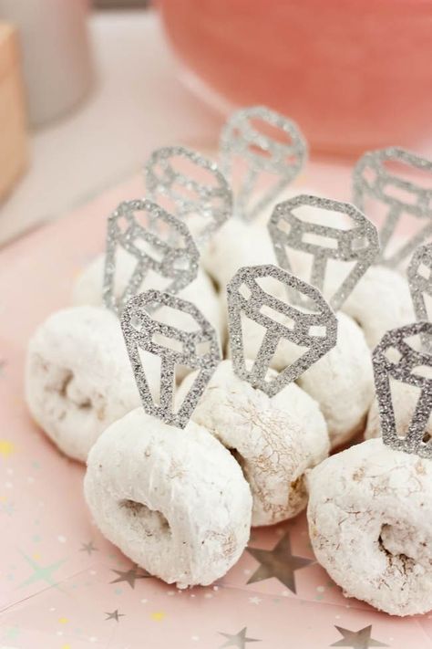 Cute donut rings! Beautiful Bridal Shower Decorations for the Modern Bride! Decorate with the Iridescent Martha Stewart Celebration Line, and personalize your party with the Cricut Explore 2! You're bride will be thrilled with the subtle glitter and glam in these pink and silver decorations! #cricutexplore #bridalshower #modernbride #woodaccents Pink Glam Bridal Shower, Simple Modern Bridal Shower Decor, Cricut Projects For Bridal Showers, Celebrating The Future Mr And Mrs, Bridal Shower Ideas Donut, Pink And Silver Bridal Shower Ideas, Cute Bridal Shower Decorations, Yellow Wedding Shower Ideas, Bridal Showers After The Wedding