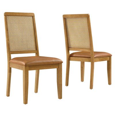 Discover the Arlo Dining Chair Set of Two, a stylish union of durability and design. These wood dining chairs boast expertly crafted faux rattan cane backrests, providing a breezy complement to the solid wood frames. Comfort is key with seats that feature dense foam padding enveloped in supple vegan leather. This set of 2 dining chairs includes non-marking foot glides protect floors from scuffs and scratches. The Arlo chairs seamlessly merge the rustic allure of farmhouse chairs with the sleekne Wooden Dining Chair Design Modern, Dining Chair Ideas, Rattan Counter Stools, Chair Design Modern, Rattan Cane, Farmhouse Chairs, Leather Side Chair, Faux Leather Dining Chairs, Wooden Dining Chairs