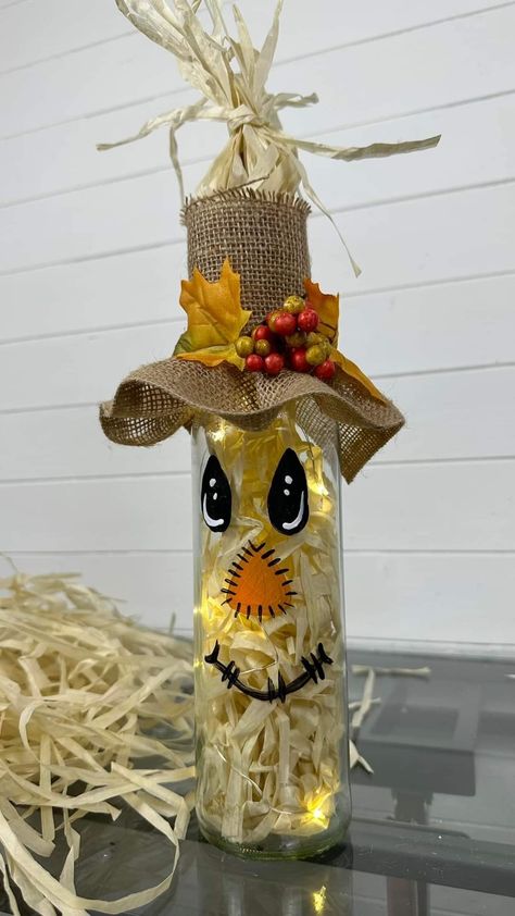 Diy Mason Jar Scarecrows, Thanksgiving Wine Bottle Crafts, Scarecrow Wine Bottle Crafts Diy, Fall Wine Bottle Crafts, Scarecrow Out Of Wine Bottles, Scarecrow Mason Jar Crafts Diy, Bottle Scarecrow Craft, Wine Bottle Scarecrow, Wine Bottle Scarecrow With Lights