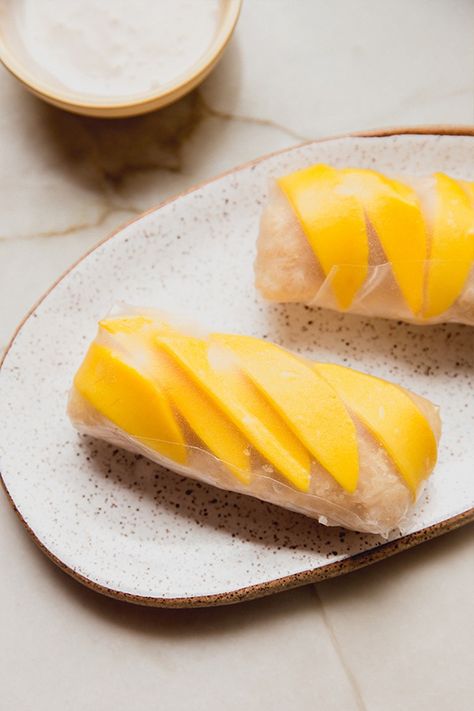 These mango sticky rice rolls are a Thai-inspired dish with a little bit of a spin! It's made with coconut mango sticky rice and wrapped in rice paper. Mango Coconut Sticky Rice, Freezer Desserts Recipes, Mango Sticky Rice Recipe, Asian Baking, Coconut Sticky Rice, Rice Paper Recipes, Thai Menu, Cooking Japanese, Unbound Wellness