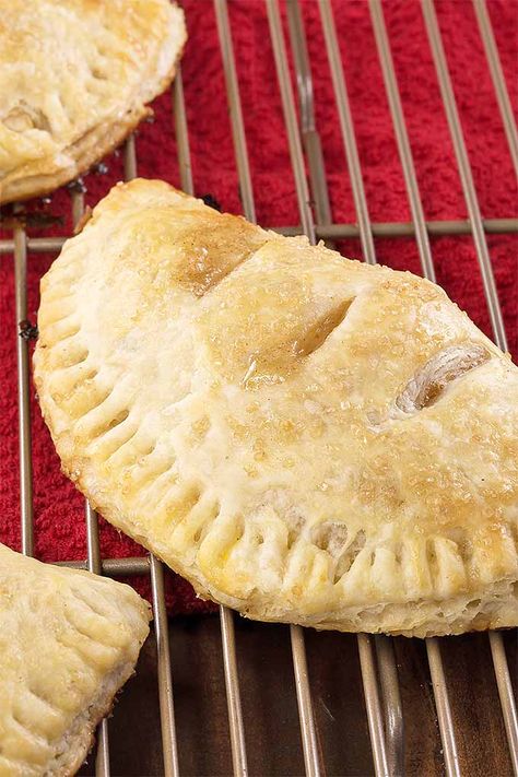 Whether you’re packing school lunches or serving up Sunday supper, surprise your loved ones with a batch of hand pies for dessert. Trust us- everything from the flaky, buttery crust to the cinnamon apple filling is on point. And they're baked rather than fried for a tasty twist on a classic. Get the recipe on Foodal. Easy Pie Desserts, Baked Apple Hand Pies, Oven Baked Apple, Homemade Crust, Hand Pie Recipes, Pbs Food, Apple Hand Pies, Classic Apple Pie, Hand Pie