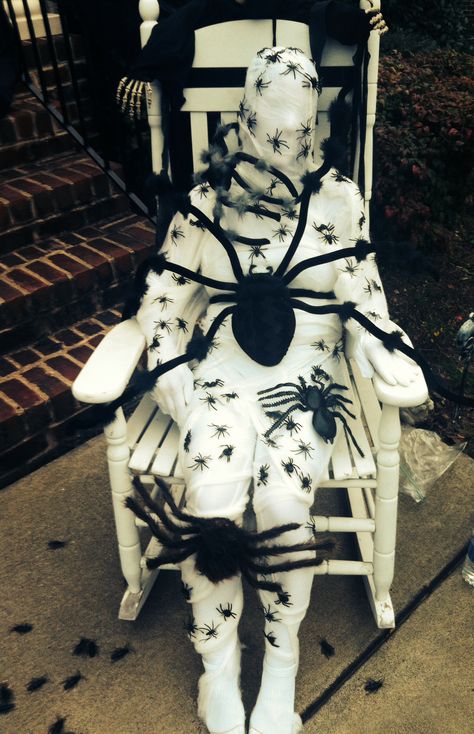 Taken over by spiders!  White morph suit, spider webbing and lots of spiders!  Was a hit! Spider Theme Halloween Decorations Outside, Big Impact Halloween Decor, Halloween Spider Display, Halloween Courtyard Decorations, Spider Haunted House, Spider Room Haunted House, Spider House Decoration, Spider Themed Halloween Decor, Scary Spider Costume