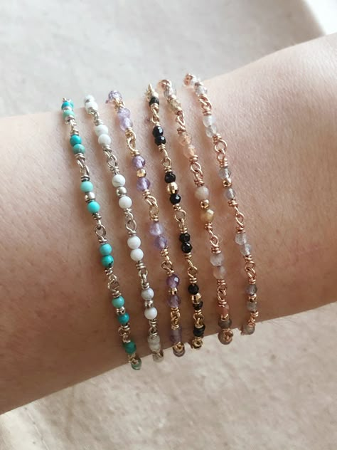 Add a little color to your wrist! We chose our favorite gemstones and hand wrapped them alongside tiny precious metal beads to add a little shimmer. This bracelet is so sweet for any occasion worn alone or stacked with other favorites. Details Gemstones: Amethyst, Turquoise, Howlite, Labradorite, Multicolor Indian Moonstone, Black Spinel Extension Chain gives additional 1/2" length to find a comfortable fit and when stacking with other bracelets. High quality 14k gold, sterling silver, or 14k go Indian Gemstone Jewellery, Silver And Gemstone Jewelry, Gemstone Bracelet Ideas, Metal Beaded Bracelets, Delicate Beaded Bracelets, Dainty Beaded Bracelets, Handmade Jewelry Diy Bracelets, Gem Bracelets, Fancy Bracelets