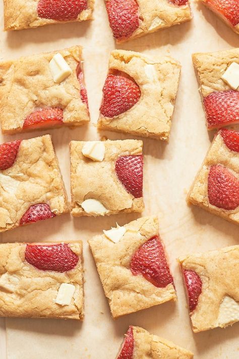 Recipe: Strawberry Blondies | The base is a classic blondie that's been seriously upgraded with the help of brown butter and a slew of chopped white chocolate. Fresh strawberry halves dot the surface — their sweet summer flavor concentrates and caramelizes in the oven, leaving you to bite into juicy, candy-like flavor in between bites of buttery, cookie-like goodness. Strawberry Blondies, Cheesecake Brownie, White Chocolate Recipes, Strawberry Desserts, Desserts To Make, Fresh Strawberries, Sweet Tarts, Strawberry Recipes, Brown Butter