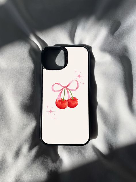 🍒💖 Indulge in the sweetness of style with our Pink Cherry Ribbon Print iPhone Case! 📱✨ This delightful accessory combines the playful charm of cherries with the elegance of ribbon patterns, creating a uniquely chic design that's perfect for the modern fashionista. 💕🎀 Ribbon Emoji, Phone Case Inspo, Phone Case Diy Paint, Pink Cherry, Iphone Prints, Aesthetic Phone Case, Diy Phone Case, Cute Phone Cases, Iphone 16 Pro