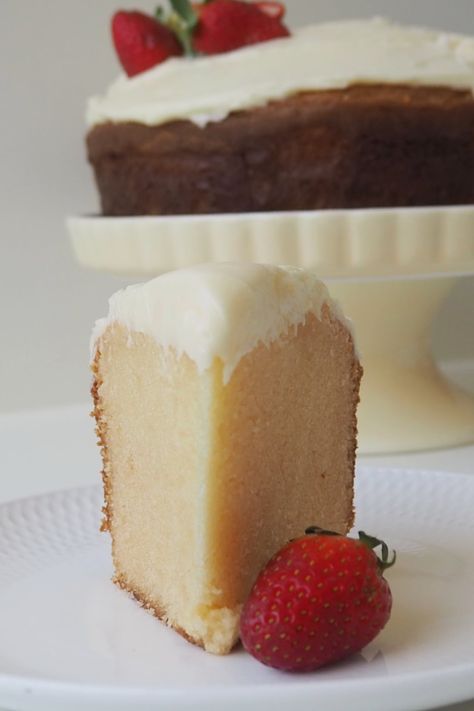 Slice of white chocolate mud cake on a white plate with a strawberry sitting next to it. White Chocolate Cake Recipe, White Chocolate Mud Cake, Best White Chocolate, Mud Cake Recipes, White Chocolate Cake, Chocolate Mud Cake, Chocolate Squares, White Chocolate Ganache, Mud Cake