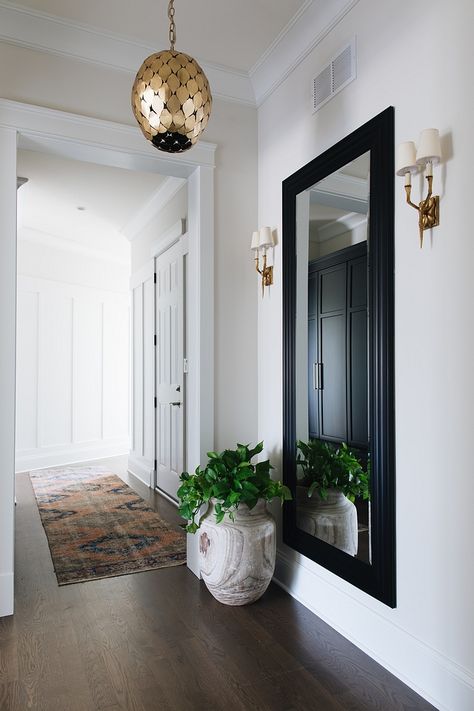 Foyer The full length mirror and gold fixtures really make this foyer area sophisticated and chic Foyer Entry Mirror Foyer Entry Mirror #Foyer #Entry #Mirror Townhouse Interior, Entrance Way, Entryway Mirror, Townhouse Designs, Hal Decor, Foyer Decor, Foyer Decorating, Classic Interior Design, Hallway Decorating