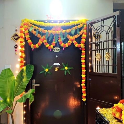 Easy way to decorate your house with flowers and leaves. I use marigold flowers and mango leaves here, insteed of mango leaves ashok leaves can also be used . I've been using sui and cotton dhaga to stick it all together , glue gun can also be used in place of it. Main Door Flower Decoration, Door Flower Decoration, House With Flowers, Diwali Home Decor, Mango Leaves, Marigold Flowers, Diwali Decor, Mehndi Design Images, Marigold Flower