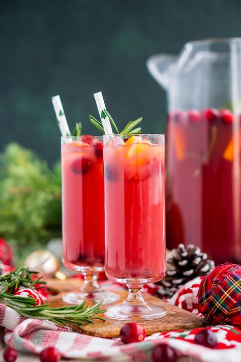 Christmas Punch is an easy and delicious holiday party drink packed with fruits like cranberries, oranges, and pomegranates. Keep it non-alcoholic or add rum or vodka for extra holiday spirit! Burgundy Punch Recipes, Cranberry Juice Punch Non Alcoholic, Cranberry Orange Drink Non Alcoholic, Cranberry Orange Prosecco Punch, Pomegranate Punch Non Alcoholic, Pomegranate Punch Alcohol, Cranberry Punch Alcohol, Christmas Vodka Punch, Vodka Christmas Punch