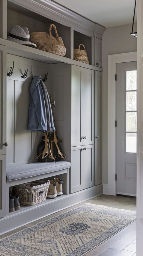 Stylish and functional entryway organization with neutral colors, built-in storage, bench, wicker baskets, and decorative rug. Entryway Organization Ideas, Small Mudroom Ideas Entryway, Mudroom Shelves, Practical Entryway, Functional Entryway, Small Mudroom Ideas, Utility Room Designs, Mudroom Remodel, Interior Design Hallway