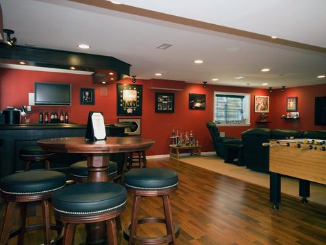 Top Six Basement Spaces | Home Remodeling - Ideas for Basements, Home Theaters & More | HGTV Orange Basement, Rec Room Basement, Sports Basement, Basement Bar Design, Bar Deco, Basement Games, Game Room Basement, Game Room Bar, Man Cave Home Bar