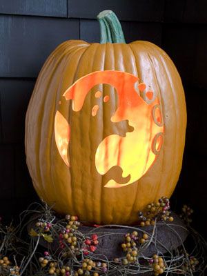 A tall, narrow pumpkin is the proper setting for this friendly ghost. Using the pattern, start with eyes and mouth, then carve inside the letters B-O-O. Remove the large area to the right of the figure, being particularly careful around   - WomansDay.com Ghost Pumpkin Carving, Printable Pumpkin Carving Stencils, Funny Pumpkin Carvings, Printable Pumpkin Stencils, Pumpkin Carving Patterns Free, Halloween Pumpkin Stencils, Lantern Template, Pumpkin Stencils, Amazing Pumpkin Carving