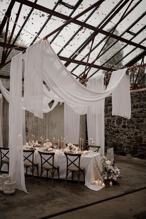 Ivory Polyester Tablecloth Wedding, Drape Wedding Reception, Fabric Drapes Wedding, Candle Table Wedding Decor, Roof Draping Ideas, Glass Room Wedding, Fairy Lights On Ceiling Wedding, Curtains Wedding Decor, Wedding Roof Draping