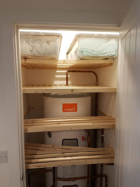 Airing cupboard shelving made in modules so that they can be easily removed Airing Cupboard Organisation With Boiler, Hot Press Organisation, Boiler Room Storage, Small Boiler Cupboard Storage, Small Airing Cupboard Storage, Hot Press Shelving Ideas, Airing Cupboard Shelving Ideas, Diy Airing Cupboard Shelves, Small Airing Cupboard Storage Ideas