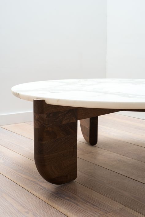 The Tripod Coffee Table is an exploration of material, texture and form. The base and top were designed to fit together as one, with the bottom curve of the stone seated neatly in the inverse curve of the wooden legs. This piece is artisan-made in our New York workshop from hand selected black walnut and the highest quality of Calacatta marble. Four Hands Coffee Table, Coffee Table Marble Wood, Marble Table Base, Wood And Stone Coffee Table, Stone And Wood Coffee Table, Wood And Marble Coffee Table, Marble Wood Coffee Table, Marble Wood Table, Marble Table Living Room