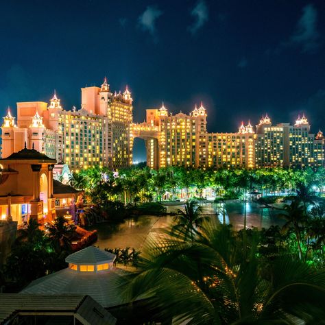 Have you been lucky enough to see the famed Atlantis Resort at night? Whether you have or not, it's always a good choice to look at pretty photos of this stellar resort in the Bahamas.  #atlantis #bahamas #caribbean Bahamas At Night, Atlantis Resort Bahamas, Atlantis Resort, Bahamas Honeymoon, Atlantis Bahamas, Bahamas Travel, Bahamas Vacation, Bahamas Cruise, Dream Vacations Destinations