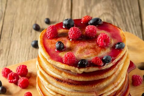 A stack of pancakes topped with raspberry syrup and fresh berries. What Is Simple Syrup, Sage Spice, Stack Of Pancakes, Grapefruit Cocktail, Make Simple Syrup, Lemon Loaf, Pancake Stack, Raspberry Syrup, Honey Syrup