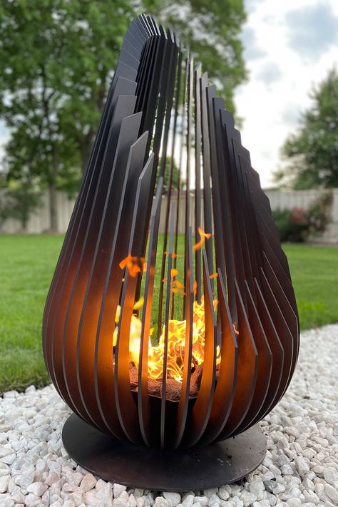 It combines sculptural metal art with a functional fire pit in the shape of a stunning giant teardrop. Metal Fire Pit, Wood Fire Pit, Wood Burning Fires, Installation Design, Metal Art Projects, Fire Pits, Outdoor Fire, Welding Projects, Outdoor Fire Pit