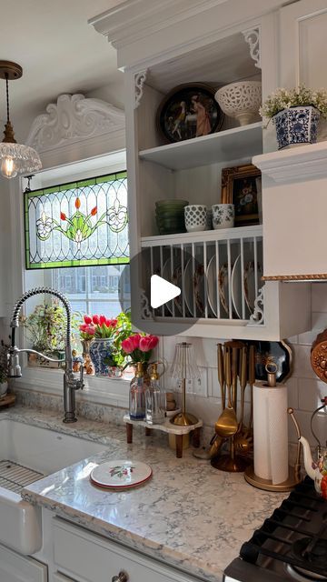 Elisa on Instagram: "✨ Open Shelving without the Demolition ✨  I’ve always loved the kitchen from the movie Practical Magic (my main inspiration when choosing our kitchen sink). The open cabinets with the plate racks are so charming, so I decided to give it a go on a budget!  I had some beadboard textured wallpaper left over from my master bedroom project (which I’ll eventually share), the wooden dowels from Home Depot cost less than $25, and the corner trim pieces were $10.99 from Amazon. I also had the white paint (color matched to my cabinets) left over from my vent hood project.  What do you think?! ☺️ I love it, and my husband does too. Nothing in this project is permanent, so if we decide to put the doors back up, it’s easily doable. Personally, I don’t see us going back, and I’m alr Practical Magic Kitchen Inspiration, Practical Magic Kitchen, Kitchen Cabinets Trim, White Paint Color, Kitchen Vent Hood, Cabinet Trim, Corner Trim, Kitchen 2024, Kitchen Vent