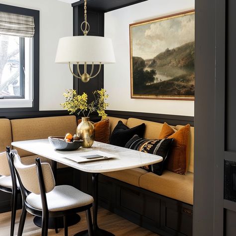 Three of my favorite things to incorporate into any design: 1. Custom Furnishings - Turning an awkward space into a custom banquette in a stunning deep yellow. 2. A Neutral, Rich Color Palette - Adds a (quiet) pop of personality but in a charming way that adds character to the space. 3. Juxtaposition - Combining modern and traditional design adds visual interest to the space, keeping your design timeless. Design: KH Home Design Counter Height Banquette Seating, Banquette Seating With Cabinets, Banquette Nook, Banquette Dining Room Ideas, Moody Banquette, Dark Banquette Seating, Dark Moody Breakfast Nook, Amber Interiors Built In Banquette, Built In Bench Seating Dining