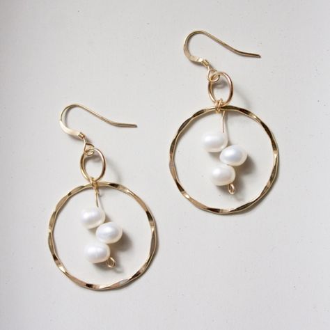 Materials: Gold Fill Earring Hooks, Rings & Wire. Pearls. Measurements: 1” Wide X 1” Long, 6mm Pearls. The Inner Glow (Orient) Of Pearls Is Thought To Tap Inner Wisdom And Nurture Love. Pearls Are Also Believed To Signify Innocence And Faith. Practitioners Use Pearls To Enhance Personal Integrity, Bring Truth Forward, Grow Sincerity, Inhibit Immodest Behavior And Advance In Wisdom. For Physical Illnesses, Pearls Have The Reputation Of Assisting With Digestive Disorders, Heart Problems, Eye Ailme Handmaid Jewelry Ideas, Heart Shaped Wire Earrings, Metal Work Jewelry, Pearl Wire Jewelry, Hammered Wire Jewelry, Pearl Jewelry Ring, Rings Wire, Wire Jewelry Earrings, Pebble Jewelry