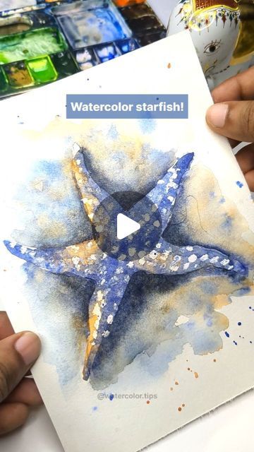 Irshad Ahmad Ansari on Instagram: "🌟 Tricks to Paint a Watercolor Starfish! 🌟  Ready to make your watercolor starfish pop? Follow these steps to create a vibrant starfish with beautiful textures:  Outline and texture the starfish, then use a white crayon to mask the details.  Blend orange and ultramarine blue to paint the starfish.  Paint the background and let it dry.  Add shadows and final details for a realistic touch.  Save this reel and share it with your friends. Follow for more watercolor tips and DM for online live classes. Happy painting!  #WatercolorTips #StarfishArt #artreels #ArtTutorial #Watercolor" Star Fish Painting, Starfish Watercolor, Fish Watercolor Painting, Watercolor Seashells, Watercolor Starfish, Instagram Tricks, Starfish Painting, Beach Landscapes, Starfish Art