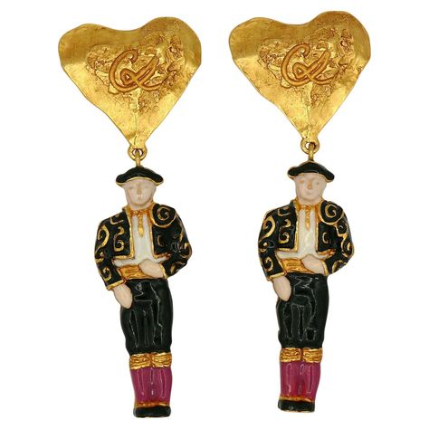 CHRISTIAN LACROIX vintage rare dangling earrings (clip-on) featuring a textured heart-shaped top embossed with a CL monogram and an enameled matador. Marked CHRISTIAN LACROIX CL Made in France. Indicative measurements : height approx. 9.3 cm (3.66 inches) / max. width approx. 3.3 cm (1.30 inches). Weight : approx. 25 grams per earring. NOTES - This is a preloved vintage item, therefore it might have imperfections. - Colors may differ slightly from actual product appearance due to differences in Cl Monogram, High Fashion Couture, Vintage Designer Jewelry, Detailed Jewelry, Virtual Fashion, Fashion Design Sketches, Christian Lacroix, Vintage Jewels, Dangling Earrings