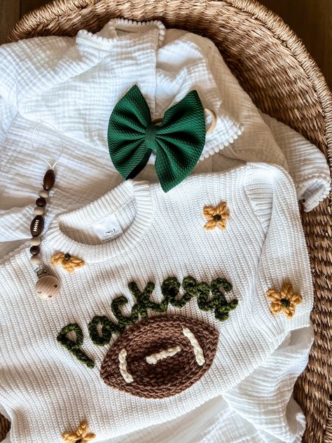 SWEATER IS OVERSIZED. Size down for a true oversized fit Personalized Hand-Embroidered Baby and Toddler Sweaters for all NFL teams Arizona Cardinals Atlanta Falcons Baltimore Ravens Buffalo Bills Carolina Panthers Chicago Bears Cincinnati Bengals Cleveland Browns Dallas Cowboys Denver Broncos Detroit Lions Green Bay Packers Houston Texans Indianapolis Colts Jacksonville Jaguars Kansas City Chiefs Las Vegas Raiders Los Angeles Chargers Los Angeles Rams Miami Dolphins Minnesota Vikings New England Things To Make With Vinyl, Little Boy Embroidery Ideas, Baby Clothes Embroidery, Baby Embroidery Ideas, Embroidery For Boys, Embroidered Baby Gifts, Gifts For Nephew, Baby Name Sweater, Hand Embroidered Shirt