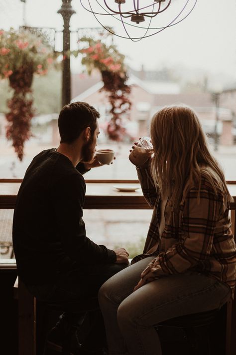 Rainy days can be a bummer if you have a photoshoot planned. ORRR… they can turn into something magical. When the forecast called for rain on the day of Maddie & Trey’s couples session, instead of getting stressed or rescheduling, they decided to embrace it. We got the coziest photos at Paper City Coffee in Chillicothe, Ohio and then went out in the gloomy weather for some moody magic! Couples Having Coffee, Coffee Shop Couple Photoshoot, Couple Having Coffee, Tea Couple, Rainy Day Photos, Couples City, Chillicothe Ohio, Prenup Ideas, Gloomy Weather