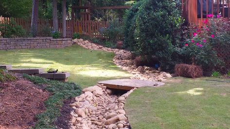 Drainage Solutions: French Drains vs. Dry Creek Beds | O'Neill Landscape Group Blog Bridge Over Dry Creek Bed, French Drain Dry Creek Bed, Dry Creek Bed For Drainage Slope, Dry Creek Bed For Drainage, Dry Creek Bed Landscape, French Drains, Backyard Drainage, Yard Drainage, Stream Bed