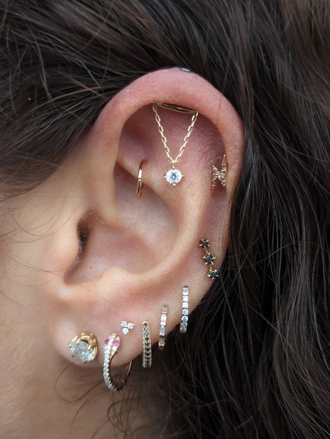 Elegant Complexity: Curated Ear with Vertical Helix Chain, Lobe Rings, and Rook Seam Ring | Gallery Chain Cartilage Earrings, Reverse Helix Piercing, Ear Piercings Placement Ideas, Vertical Helix Piercing Jewelry, Hole Ear Piercing, Lobes Piercing, Floating Helix Piercing, Vertical Helix Piercing, Stacked Lobe Piercing