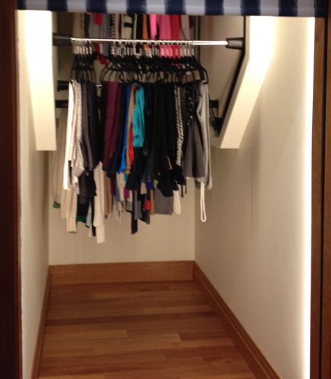 Vertical revolving clothes for closet. Great Idea for understairs seasonal storage or coat storage! Under Stairs Storage Closet Coats, Under Stairs Clothing Closet, Under Stair Clothes Closet, Stairway Closet Ideas, Under Stairs Coat Storage, Narrow Coat Closet, Coat Closet Ideas, Stairs Closet, Seasonal Storage