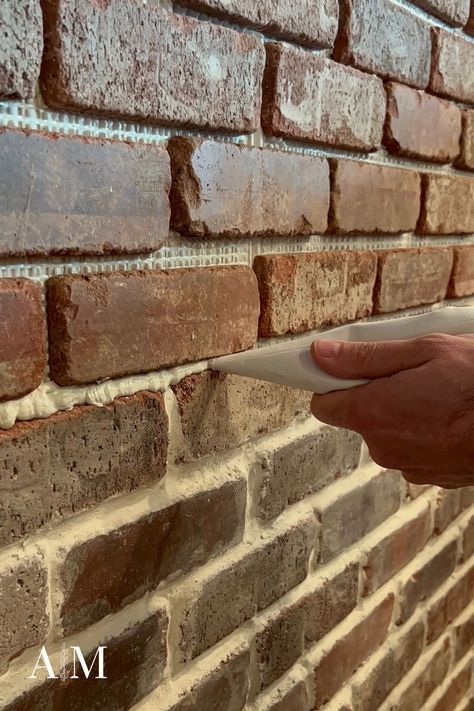 Bricks Backsplash Kitchen, Grout Colors For Brick, Re Grouting Brick Fireplace, Brick Floor Grout Color, Brick Veneer Accent Wall, How To Grout Brick Backsplash, Brick Wall With Floating Shelves, Grouting Brick Backsplash, Brick In Bathroom Accent Walls