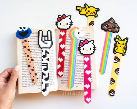 Lets make reading even more fun with these sooooo cute new bookmarks ♡ My favorites are the poop, the rock sign and the pika, which is… Perler Anime, Melt Beads Patterns, Rock Sign, Hamma Beads Ideas, Pokemon Bead, Perler Creations, Pearl Beads Pattern, Hama Beads Design, Perler Bead Templates